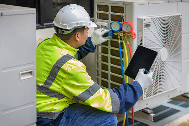 Professional Air Conditioning Repair technician working in Oakwood, IL